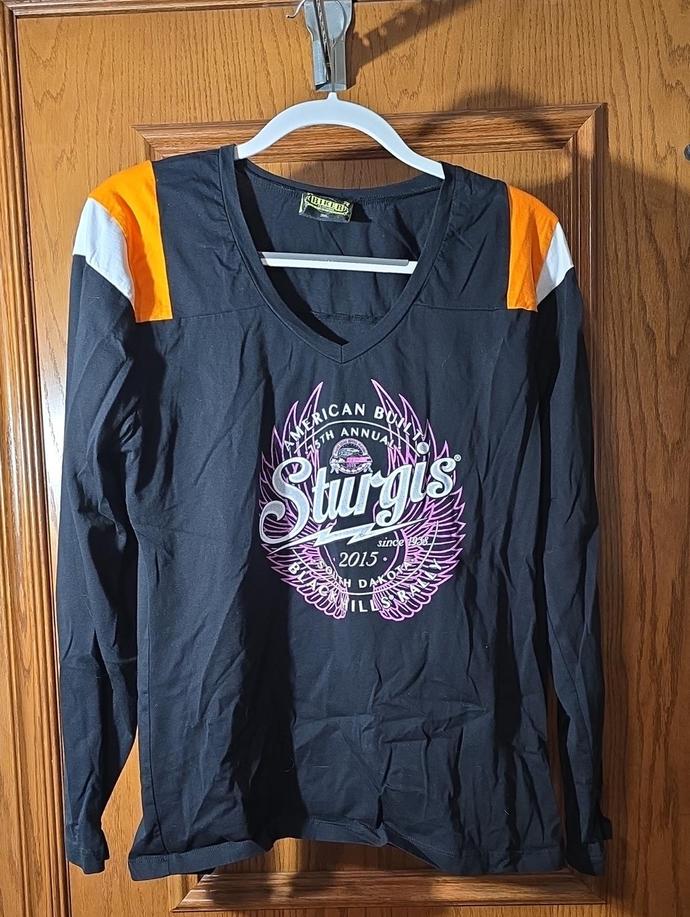 Sturgis Women's Black Long-Sleeve V-Neck Top with Orange Accents